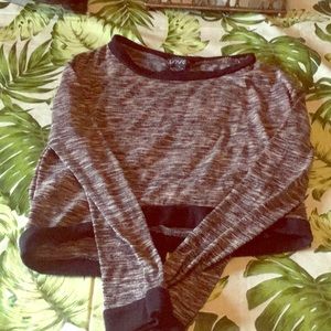 Sweater shirt slightly crop with open back.